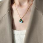 Titanium steel heart pendant necklace with a sleek design, featuring a shiny silver finish and a delicate chain.