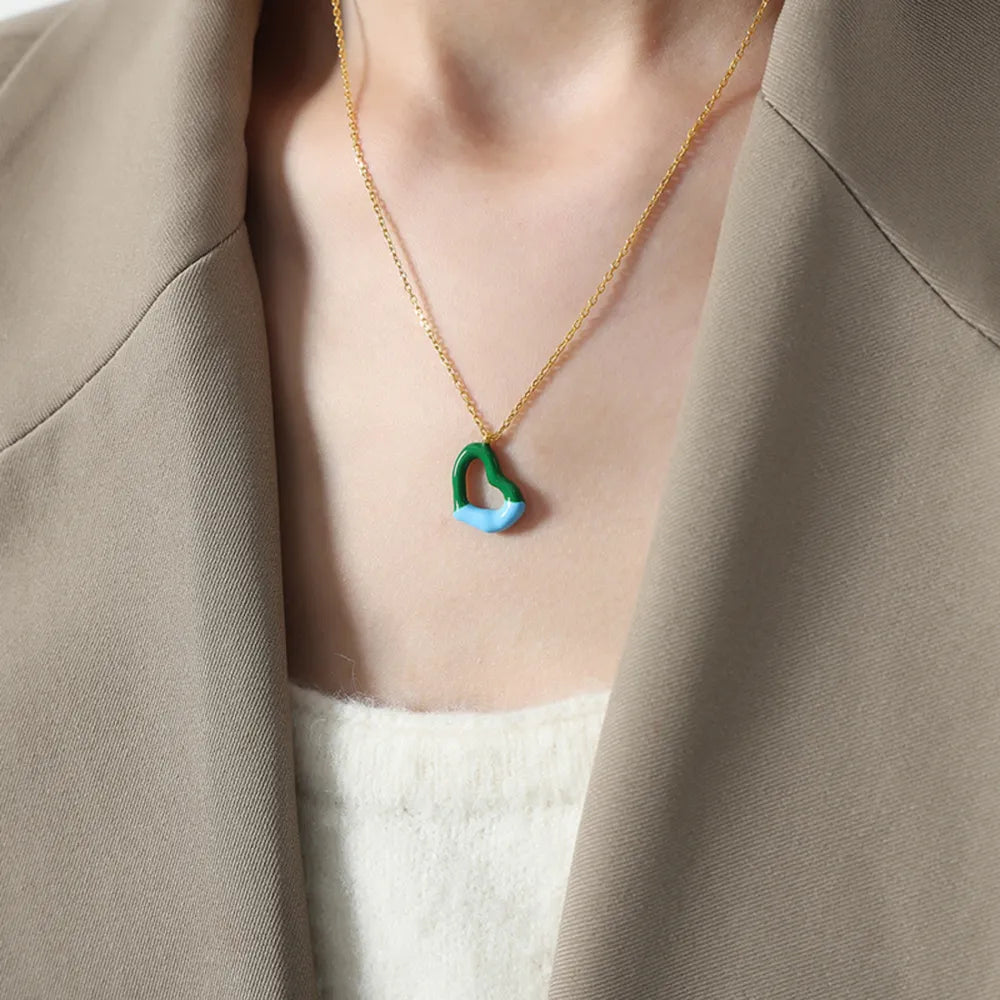 Titanium steel heart pendant necklace with a sleek, polished finish, featuring a stylish design perfect for everyday wear.
