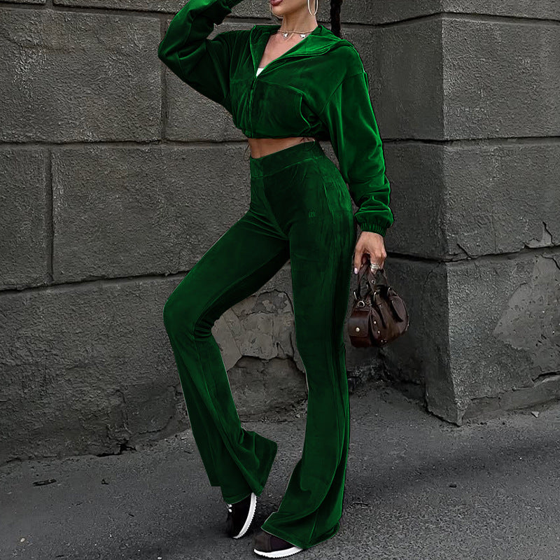 Women’s autumn velvet two-piece set with high-waist top and flared pants from Plush Fashion Hub, shown in a stylish indoor setting.