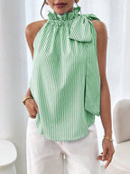 Women's striped sleeveless blouse by Plush Fashion Hub featuring ruffle high neck, lace trim, and tie-knot bow detail.