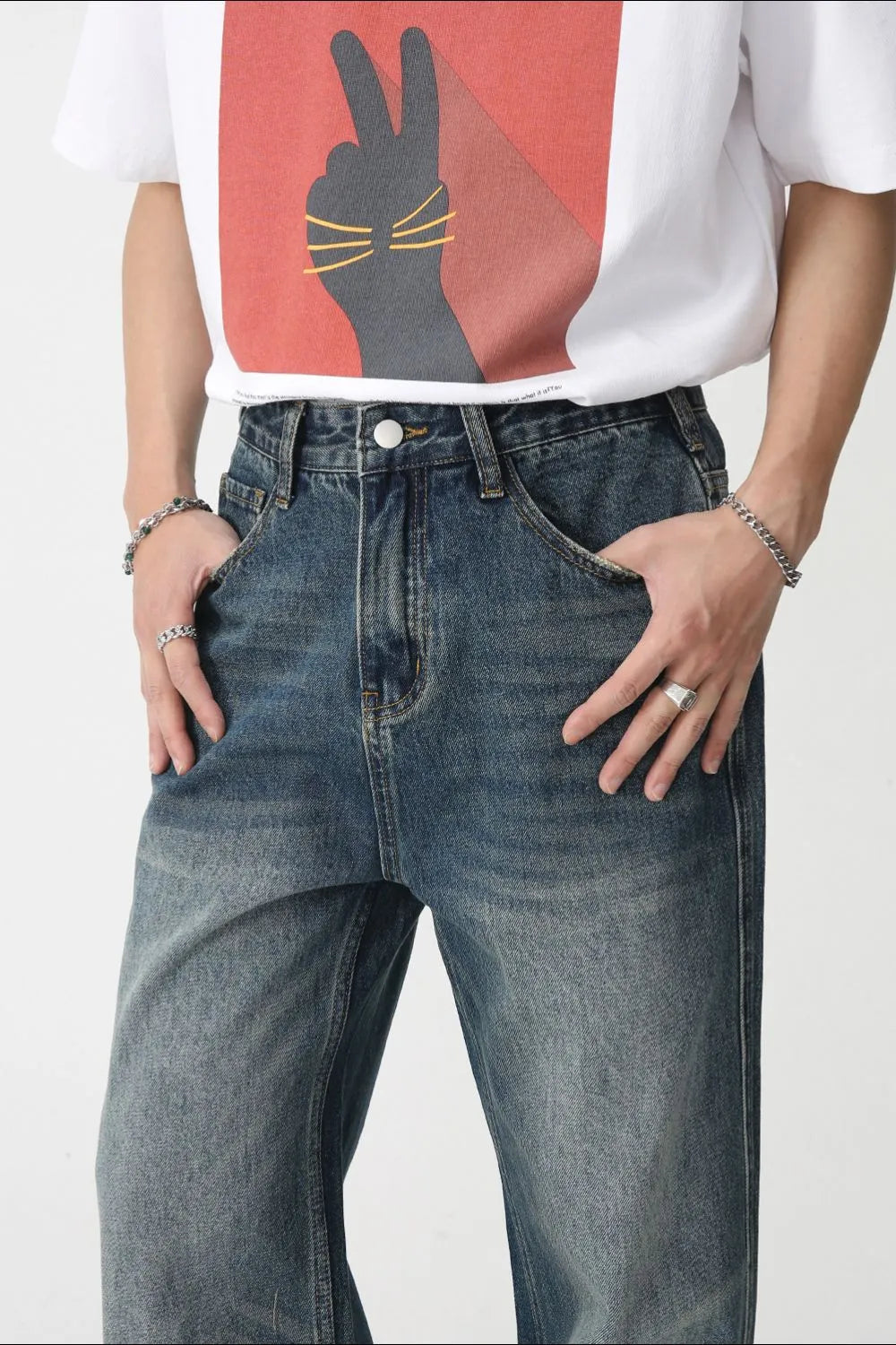 Plush Fashion Shop denim bootcut jeans with front pockets, classic blue wash, and relaxed fit, displayed on a white background.