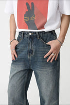 Plush Fashion Shop denim bootcut jeans with front pockets, classic blue wash, and relaxed fit, displayed on a white background.