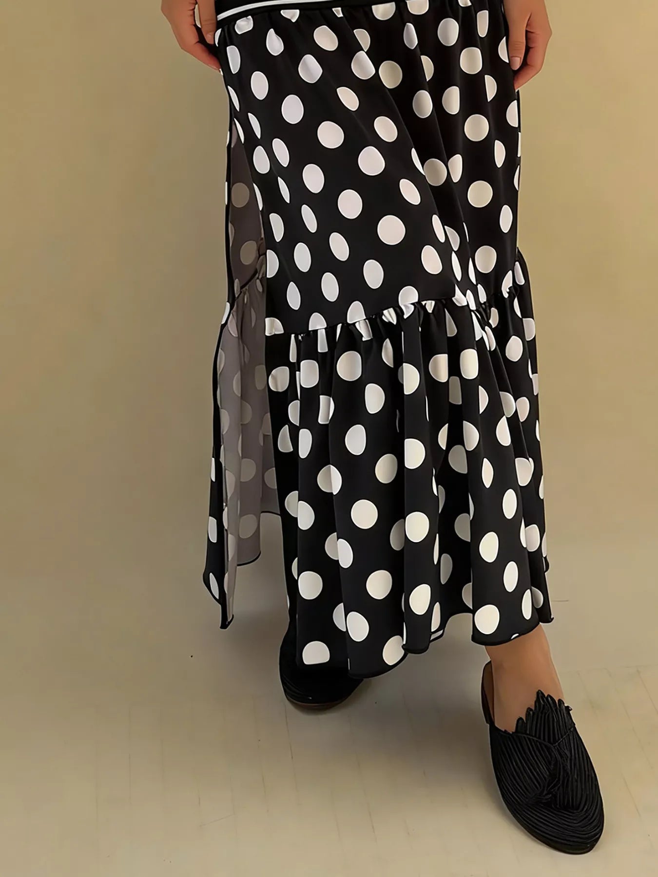 Flowy women's polka dot and striped slit maxi skirt by Trendsi, featuring bohemian casual style and lightweight, flowing fabric.