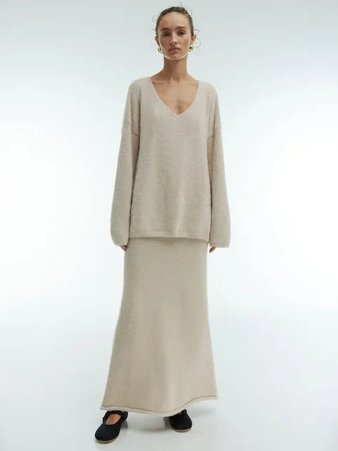 Women’s knitted V-neck sweater and skirt set by eprolo, featuring a cozy autumn casual pullover and warm fashion skirt.