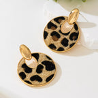 Leopard circle dangle earrings by Shopimist featuring gold-tone hoops with leopard print and dangling design.