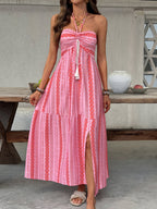 Printed halter neck smocked midi dress with side slit, stylish Trendsi dress shown in a vibrant floral pattern.