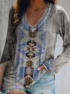 Plus size Geometric Print V-neck long sleeve T-shirt from Trendsi, casual comfortable top with bold geometric pattern.