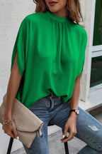 Plush Fashion Hub elegant tie-back half-sleeve blouse with side slit, featuring a stylish design and lightweight fabric.
