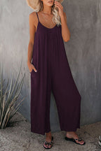 Women's pleated chest cross-strap jumpsuit by Plush Fashion Hub, featuring a stylish design and comfortable fit.