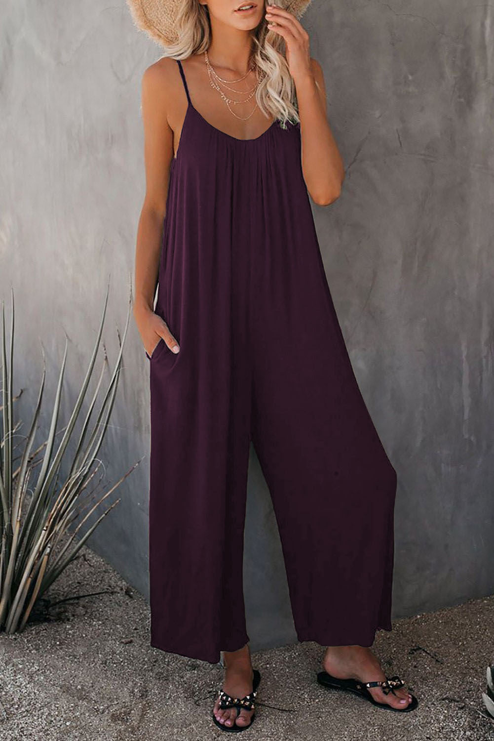 Women's pleated chest cross-strap jumpsuit by Plush Fashion Hub, featuring a stylish design and comfortable fit.