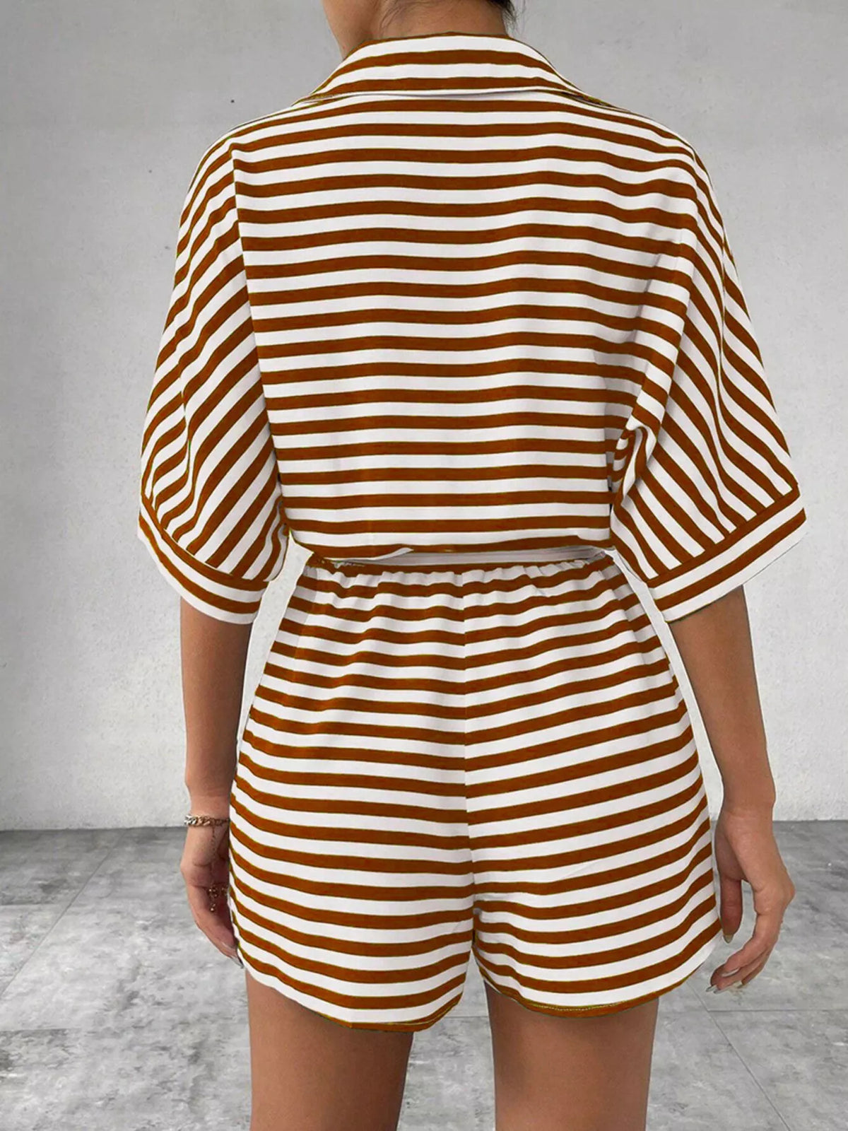 Striped button front half sleeve romper shirt by Plush Fashion Hub, casual summer clothing with a stylish design.