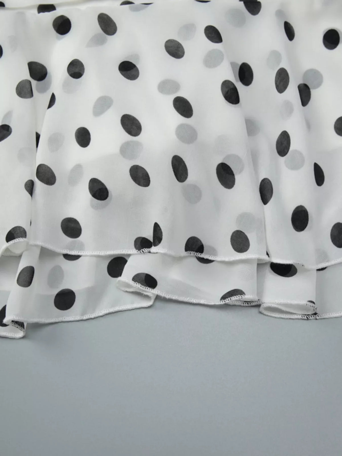 Polka dot halter neck ruffle dress by Plush Fashion Hub featuring a feminine design with ruffled details and a halter neckline.