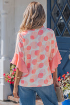 Light blue Angelica short sleeve babydoll blouse by Threaded Pear with flowy fabric and relaxed fit, shown on a model.