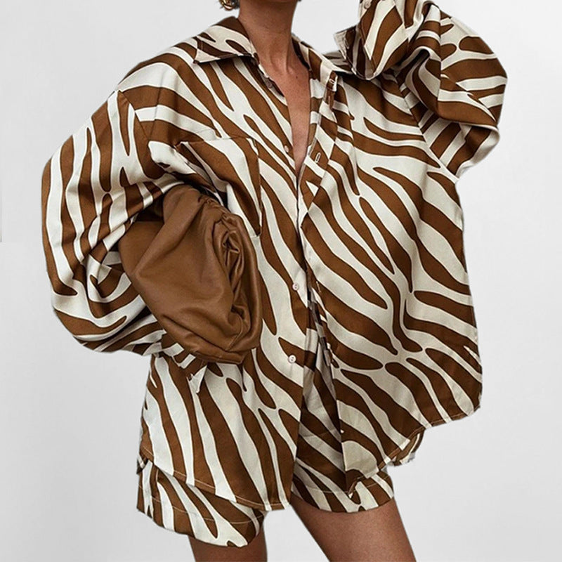 Printed short sleeve two-piece set from Plush Fashion Hub, featuring stylish tops with vibrant patterns and comfortable fit.