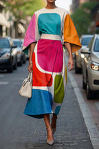 Flowy maxi dress with geometric print, batwing sleeves, casual style from Plush Fashion Hub in size XS to XXXL.