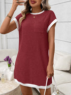 Ribbed knit mini dress with contrast trim and functional pocket, stylish and fitted by Trendsi, shown on a model.