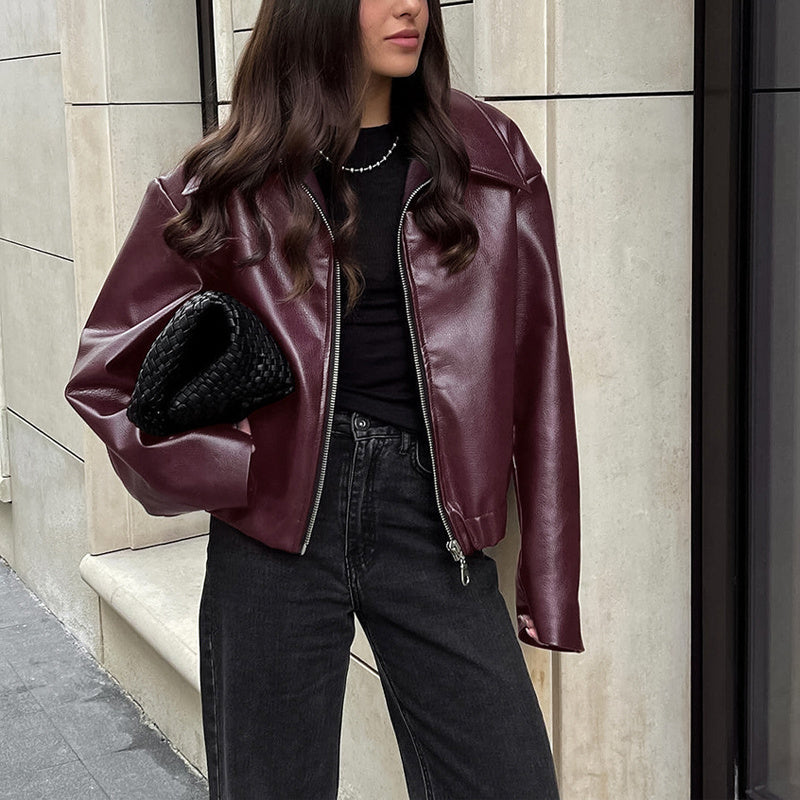 Vintage style women's solid color faux leather jacket from Plush Fashion Hub, featuring classic design and sleek fit.