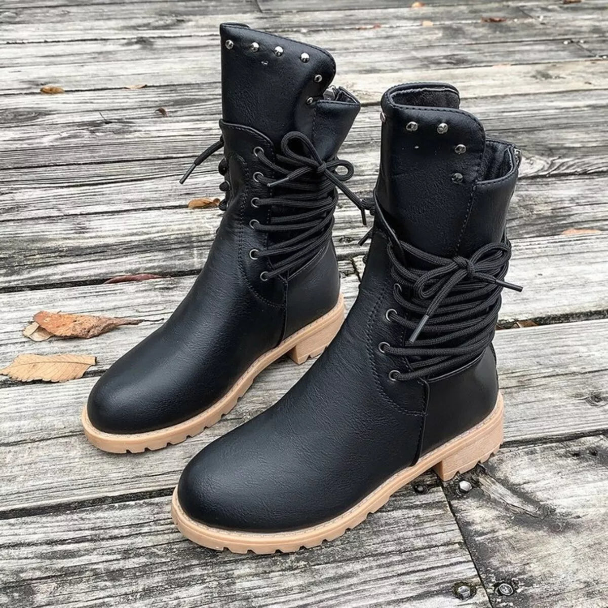 Lace-up block heel boots by Trendsi featuring stylish footwear design with chunky heels and ankle-high lace-up style.