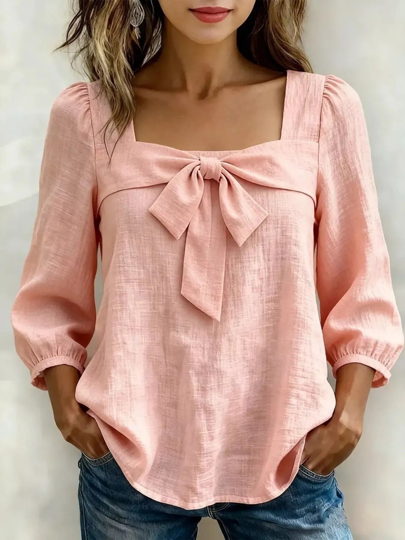 Plus size square neck bow front blouse for women, trendy tops by Trendsi, featuring a stylish neckline and feminine bow detail.