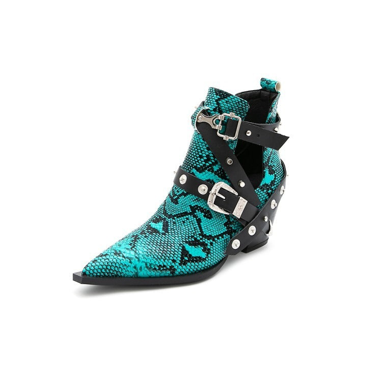 Teal and black snakeskin leather ankle boot featuring a pointed toe, black buckled straps, and silver studs.