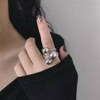 Shopimist multi-layered ball ring with stacked silver bands, featuring small ball accents and a sleek, modern design.