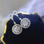 4 carat crystal drop dangle earrings with round halo design, featuring sparkling crystal accents and elegant craftsmanship.
