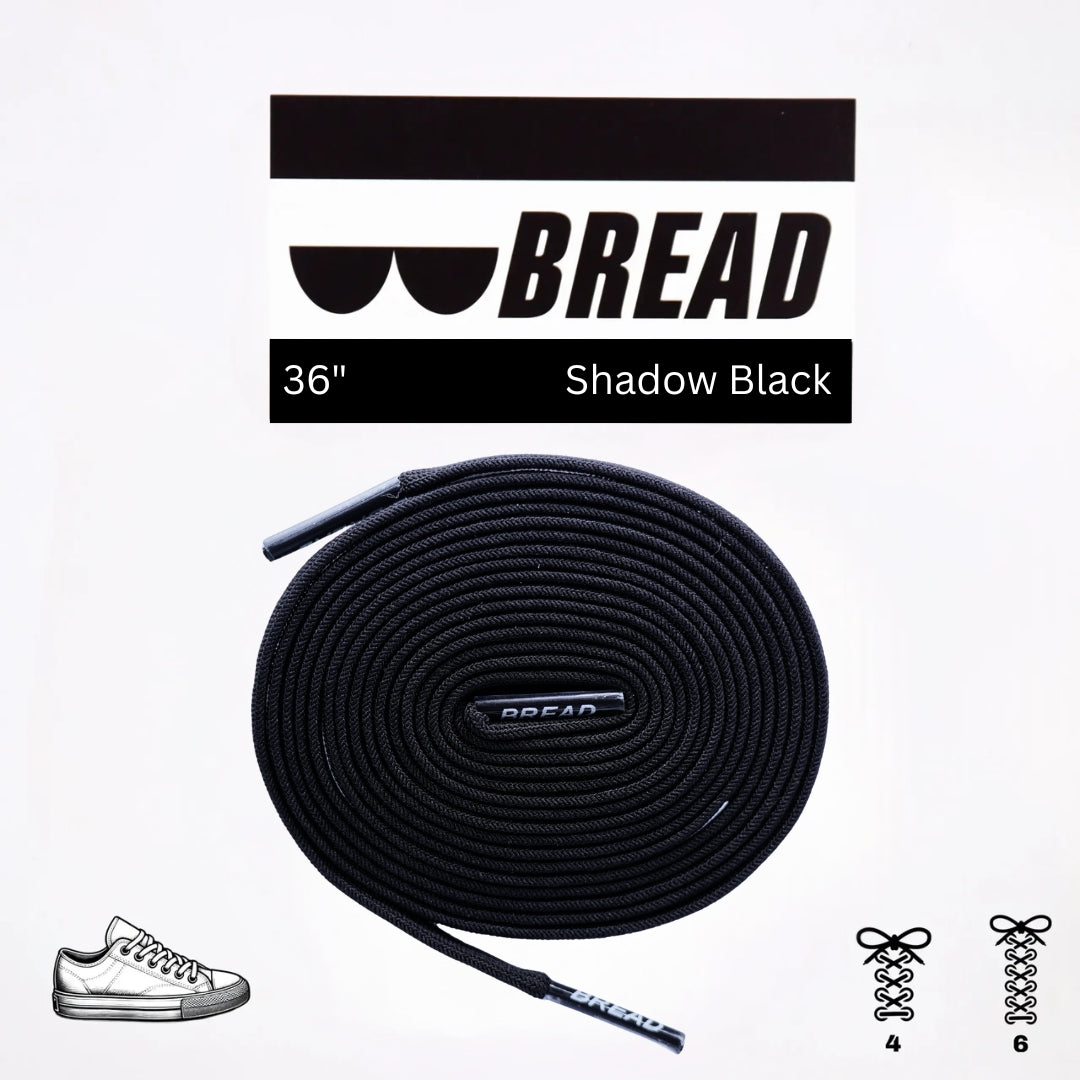 Black elastic shoelace from Plush Fashion Hub's Shadow Black collection, showcasing a sleek, flexible design for comfortable fit.