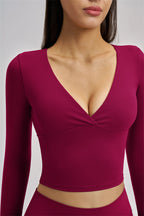Fitglutes Activewear long sleeve crop top with snug fit, lightweight fabric, and stylish design for workout and active wear.