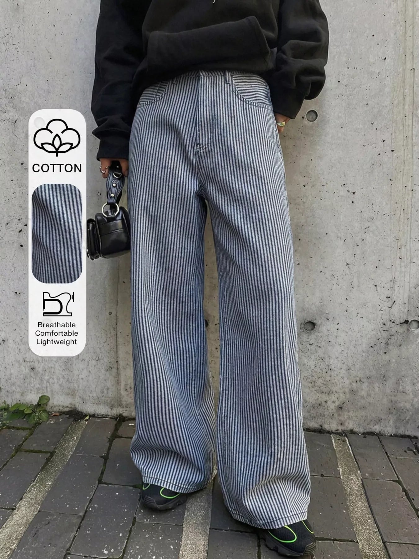 Shopimist striped wide-leg jeans with a high waist, featuring bold vertical black and white stripes and relaxed fit.