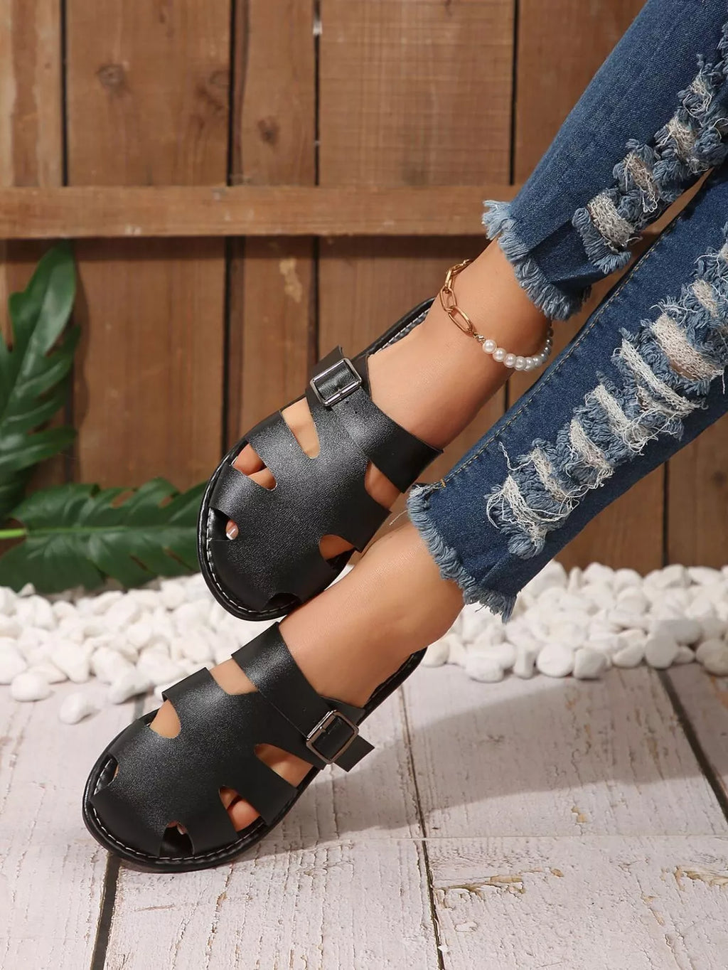 Leather slip-on sandals with adjustable buckle from Shopimist, showcasing a comfortable design and stylish footwear.