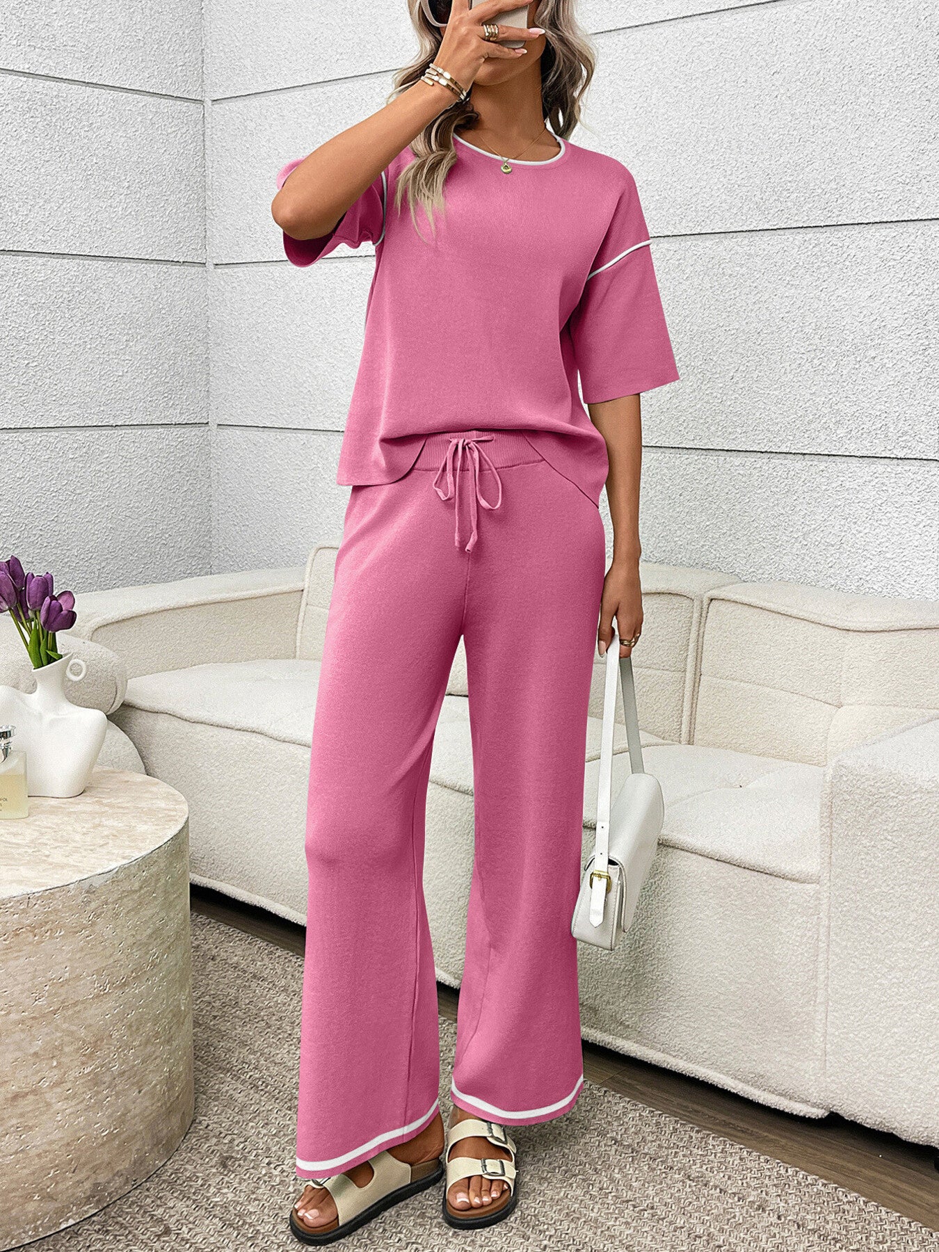 Women's casual two-piece lounge set with round neck top and drawstring pants, trendy and comfortable for relaxed wear.