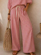 Plus size striped puff sleeve shirt and wide-leg drawstring pants set by Trendsi, featuring a comfortable and stylish coordinated outfit.