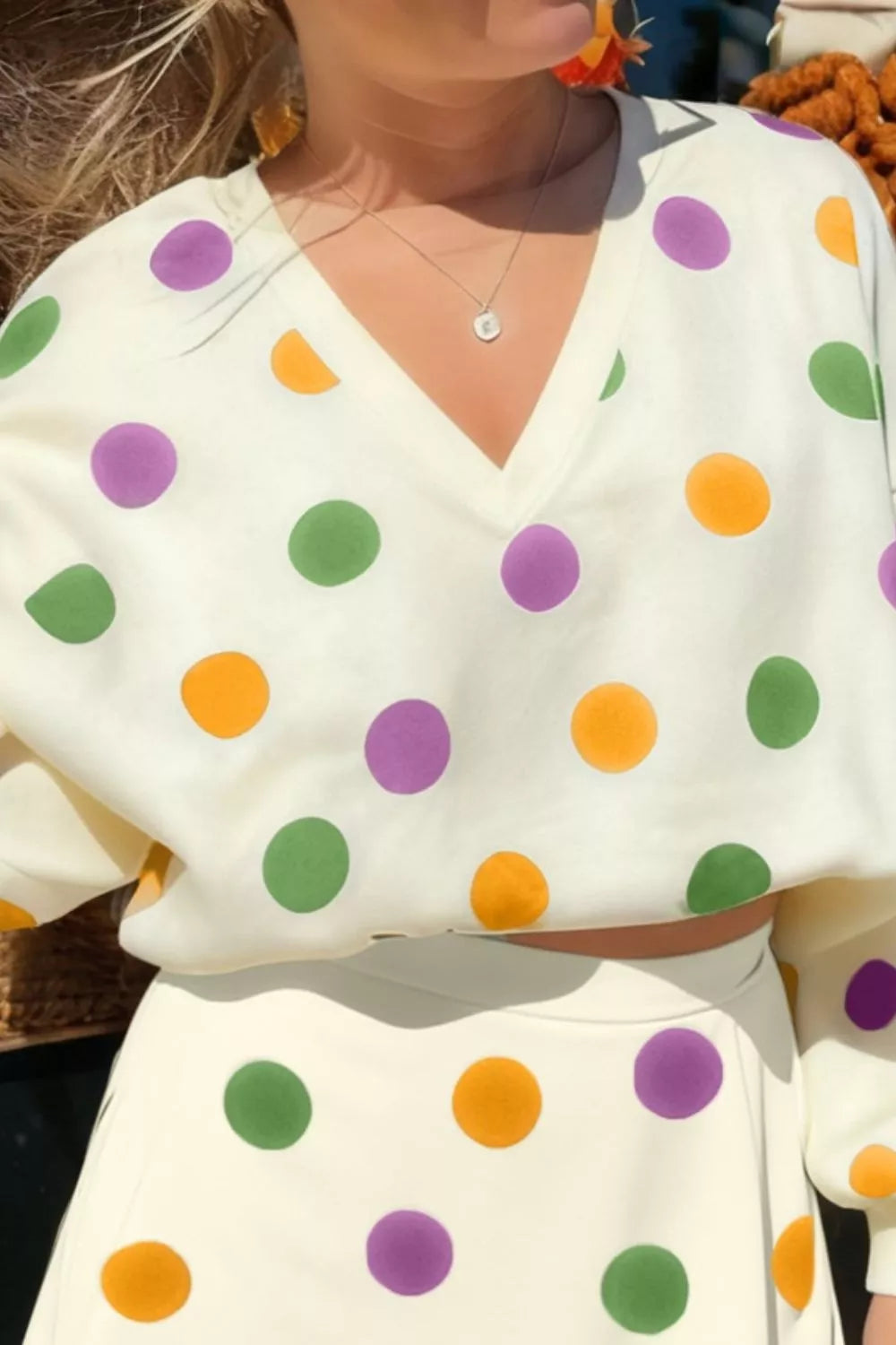 Polka dot V-neck top and matching skirt set from Plush Fashion Hub, featuring a stylish, coordinated ensemble with a V-neck design.