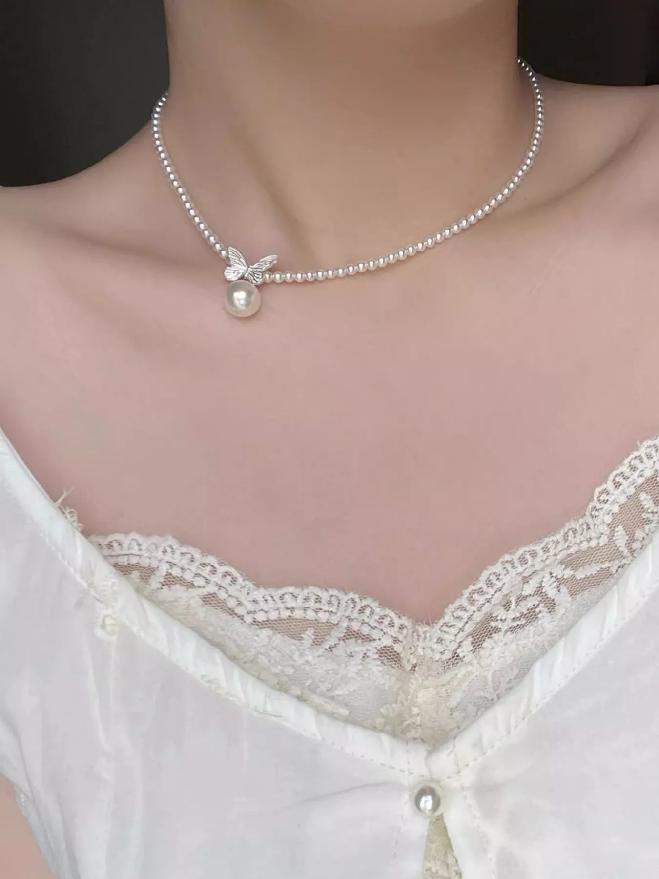 Pearl butterfly pendant necklace by Shopimist featuring a delicate pearl butterfly charm on a fine chain.