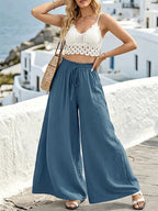 Wide leg drawstring pants from Shopimist with relaxed fit, featuring a comfortable waistband and flowing fabric.