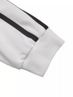 Side striped round neck sweatshirt from Trendsi, featuring casual tops with contrasting side stripes and a comfortable fit.