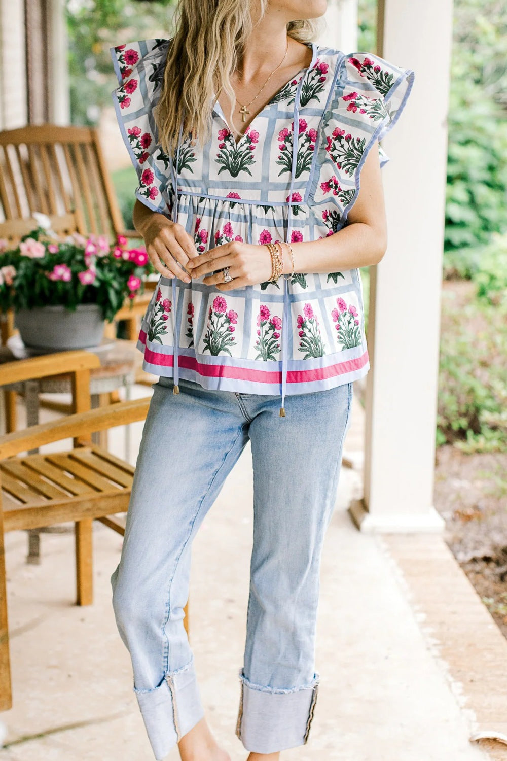 Women's floral print ruffle sleeve blouse with tied neckline, lightweight fabric, perfect for casual or semi-formal wear.