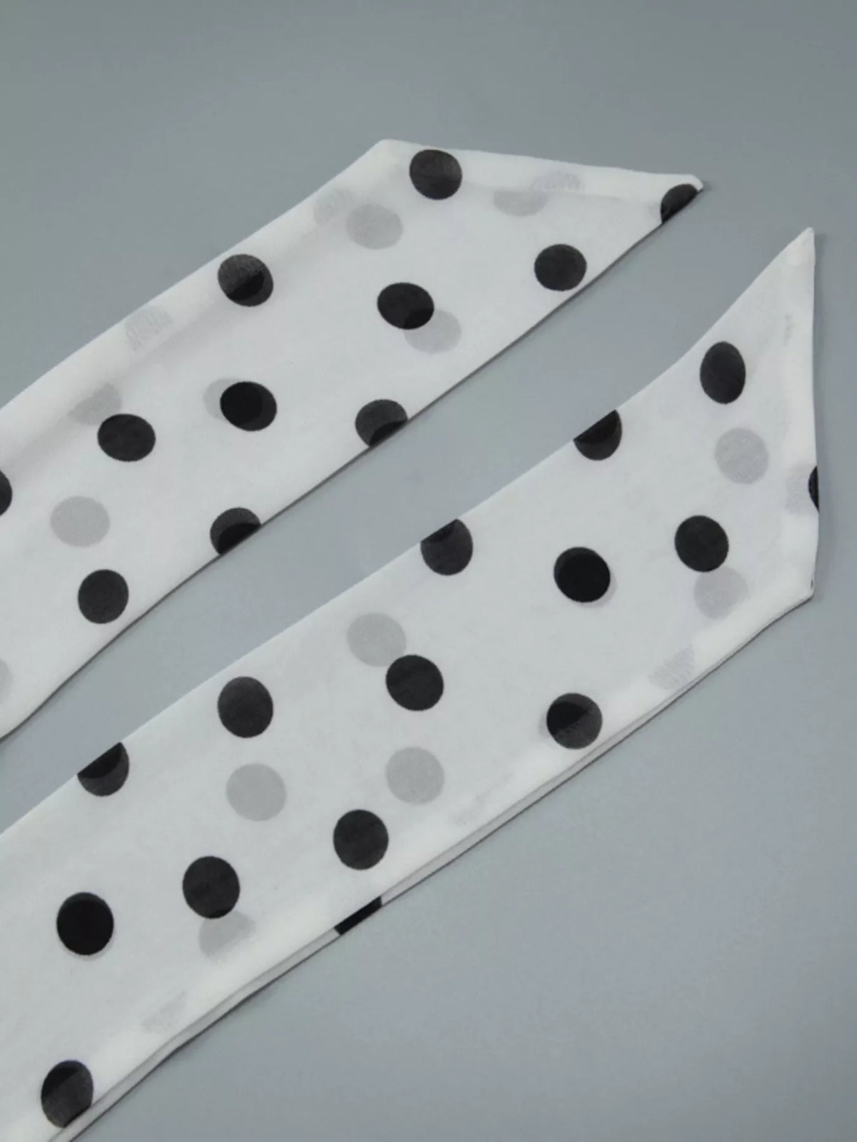 Polka dot halter neck ruffle dress by Plush Fashion Hub featuring a stylish sleeveless design and playful polka dot pattern.