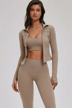 Fitglutes Activewear sports bra, leggings, and zip jacket set featuring cross-back design for workout and gym activities.