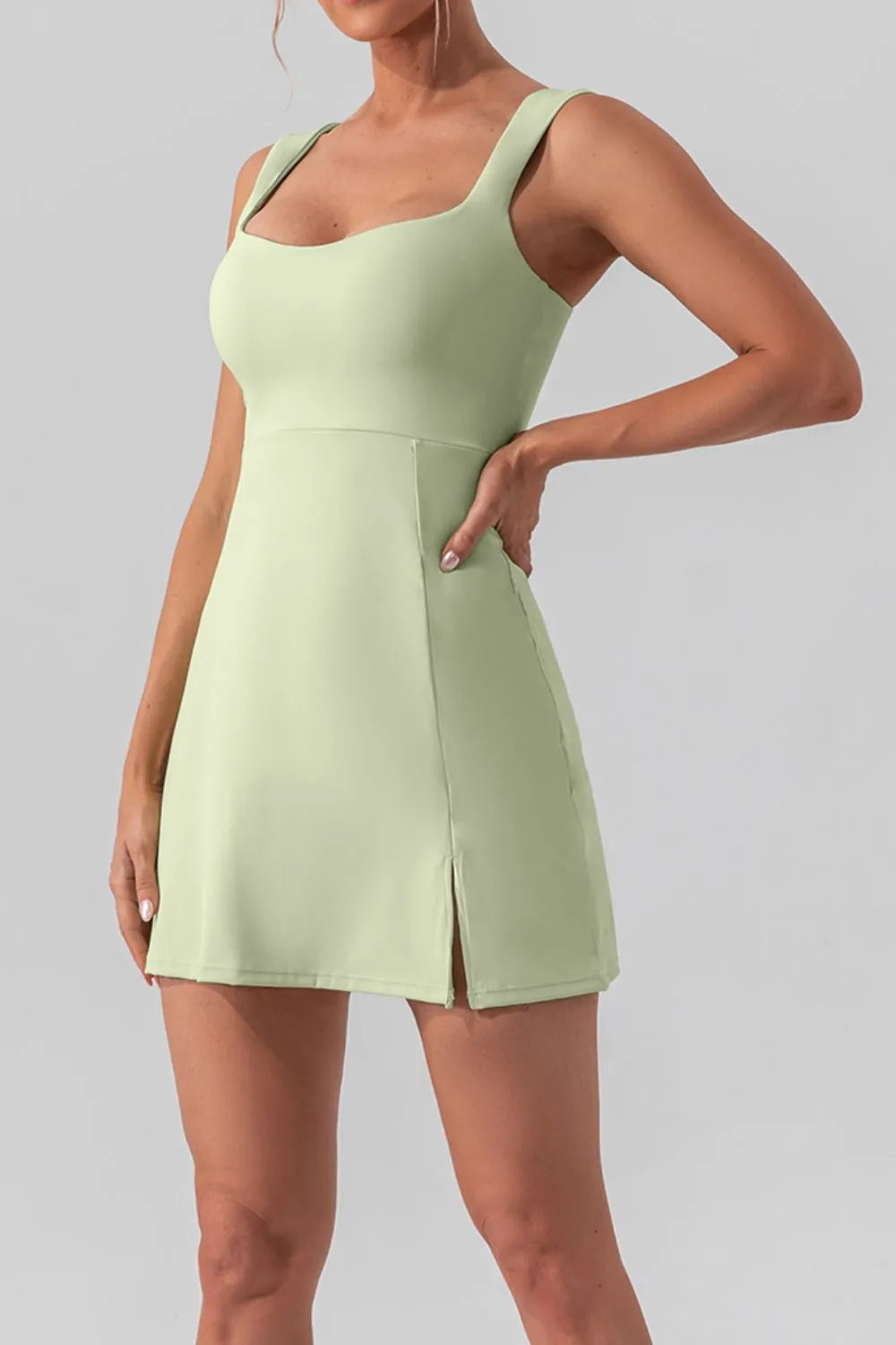Square neck sleeveless mini active dress by Trendsi with slit detail, perfect for workout or casual wear.