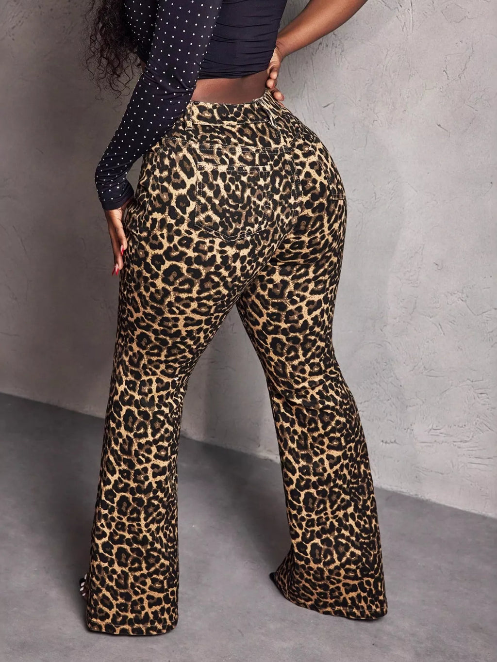 Leopard print wide-leg pants from Shopimist featuring a stylish relaxed fit and bold animal pattern.