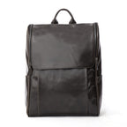 Black leather computer backpack with plush design, featuring multiple compartments and padded straps for comfortable carrying.