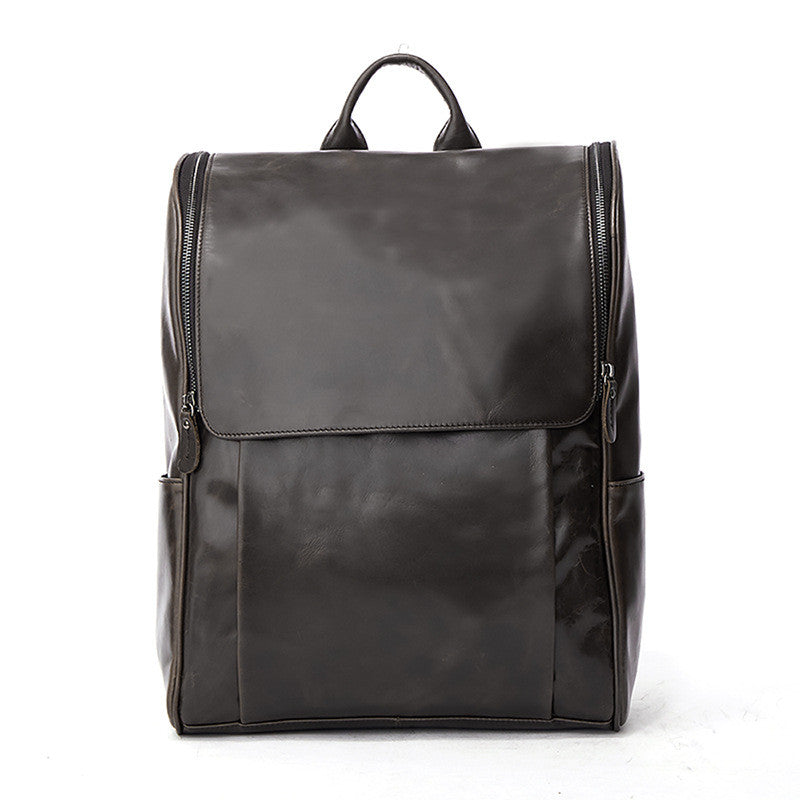 Black leather computer backpack with plush design, featuring multiple compartments and padded straps for comfortable carrying.