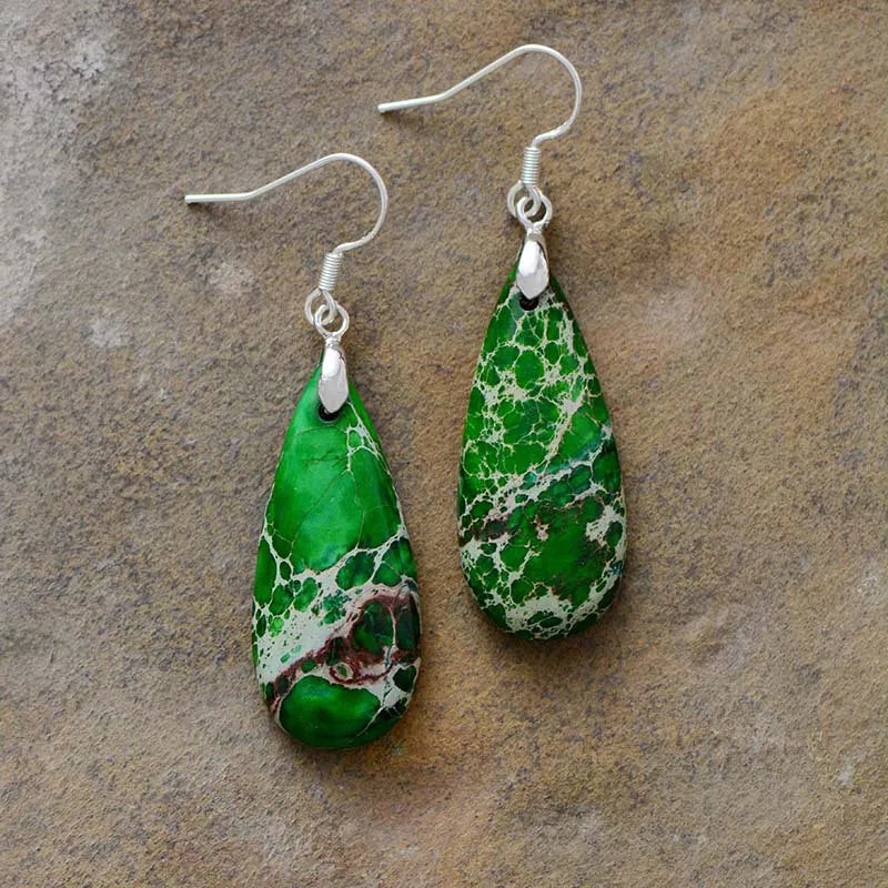 Natural stone copper teardrop earrings with a polished finish, featuring elegant teardrop shapes and earthy tones.