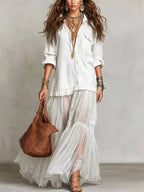Long sleeve sheer ruffle maxi dress by Shopimist featuring flowing fabric and elegant ruffle details.