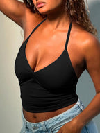 Women's black halter neck slim fit cami top by Trendsi, sleeveless stretch tank with fitted design, ideal for casual or summer wear.