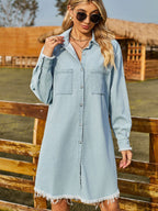 VYSN denim dress with button-up front, collared neck, and raw hem, featuring a casual, stylish design.