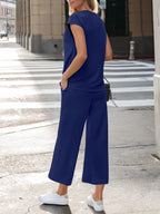 Women's notched short sleeve lounge set with pockets, 2-piece set by Trendsi, featuring comfortable fabric and relaxed fit.