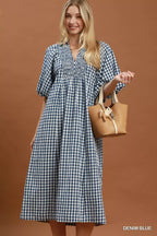 Umgee puff sleeve plaid midi dress with a fitted waist and button-front design, styled with a feminine silhouette.
