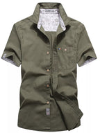Men's plus size casual short-sleeve button-up shirt by Trendsi, featuring a lightweight fabric and classic collar in a relaxed fit.